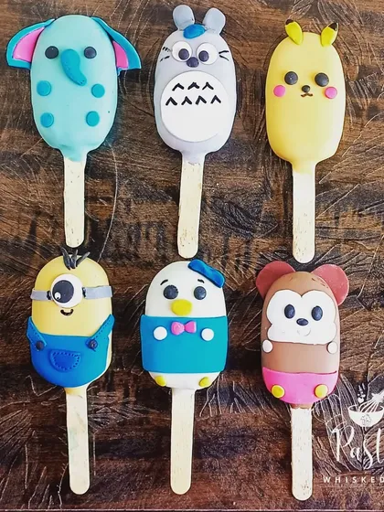 I love bringing your favorite characters to life with these custom-made cakesicles. These fun, bite-sized treats are filled with cake and ganache, perfect for kids' parties or as a unique gift.
