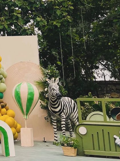 A different perspective of Avyaan's Mickey Mouse safari, showing a zebra and a safari jeep prop, adding more fun elements to the adventurous theme.