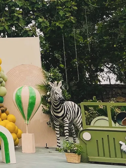 A different perspective of Avyaan's Mickey Mouse safari, showing a zebra and a safari jeep prop, adding more fun elements to the adventurous theme.