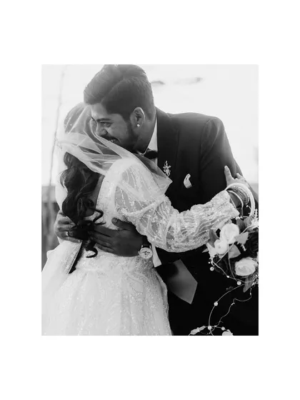 A heartfelt embrace after the ceremony. This black and white shot of Malvin and Natalie captures the relief, joy, and deep love of a newly married couple.