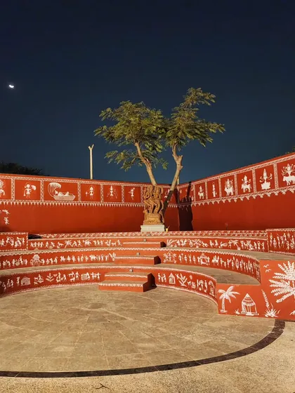 We covered this entire outdoor amphitheater at Epsilon in traditional Warli art. The artwork flows across the curved seating tiers, telling stories of village life and culture, turning a public space into a massive canvas.