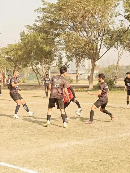 Players battling for possession in the midfield. This image captures the high-pressure, competitive nature of our league games.
