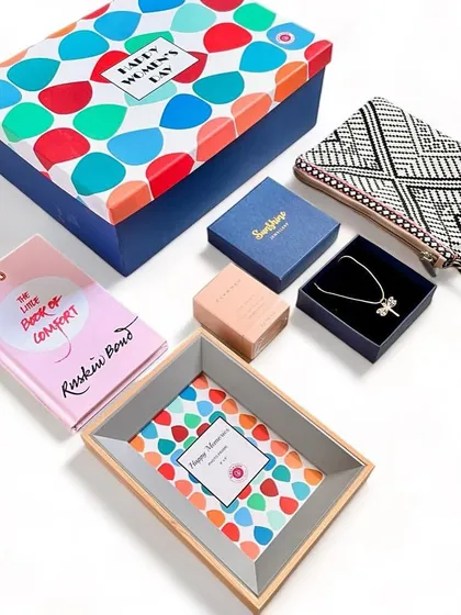 Our Women's Day gift sets are designed to feel like a warm hug. This one includes a book by Ruskin Bond, a beautiful clutch, jewelry, and a keepsake tray.