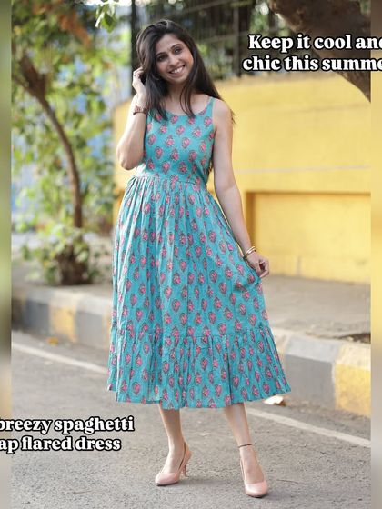 Keeping it cool and chic this summer in my breezy spaghetti strap flared dress. It’s the perfect outfit for a sunny day.