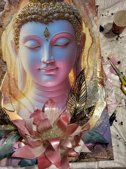 A 3D photo resin art piece of Buddha in progress. My workshop teaches you how to create the big lotus and other 3D elements by hand to give the artwork a stunning, layered effect.