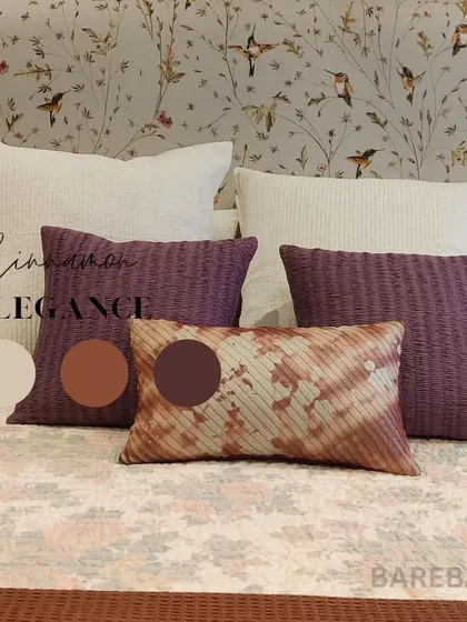 Cinnamon elegance. Another detail shot from the same project, this time pairing a delicate hummingbird wallpaper with textured purple and tie-dye accent pillows.