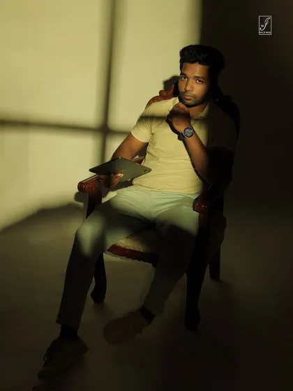 A direct look at the camera through the shadows, creating a powerful and engaging conceptual portrait.