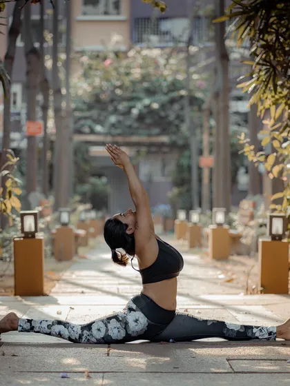 This is Hanumanasana, the full splits, a pose named after the great leap of the Hindu deity Hanuman. It’s a deep hip opener that teaches us that with devotion and steady practice, or *abyhasa*, we can achieve things we once thought were impossible.
