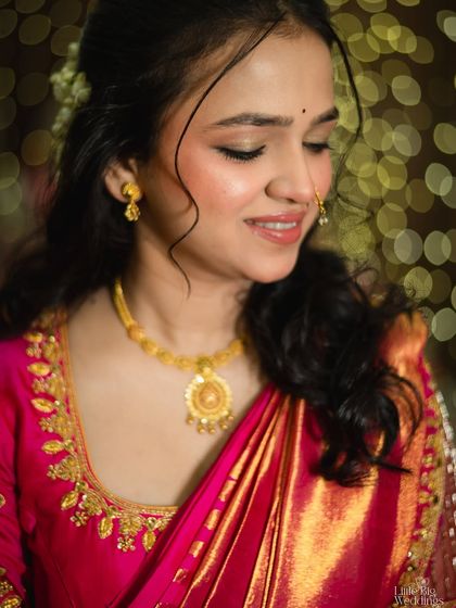 A soft and gentle portrait of a bride, with a beautiful bokeh background. Her serene expression is captivating.