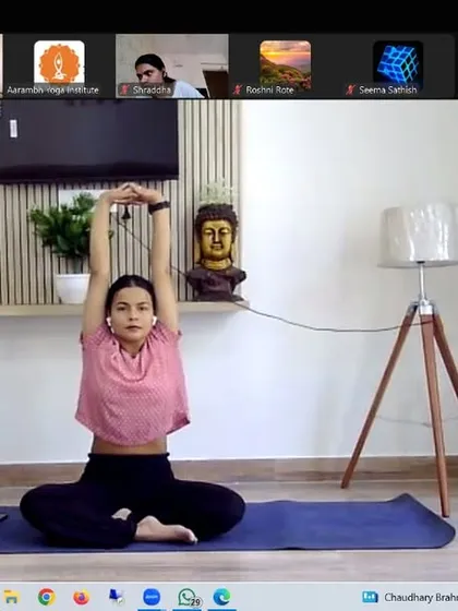 A seated stretch with arms raised overhead helps to lengthen the spine and release tension in the shoulders and upper back. This simple movement can be done anywhere to counteract the effects of sitting for long periods.