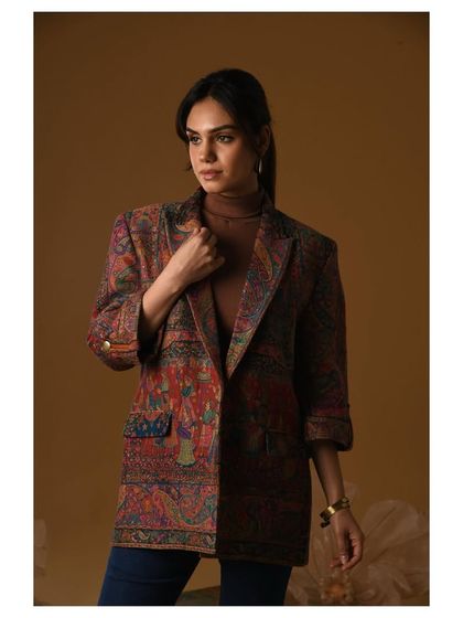 A printed blazer styled with a simple turtleneck and jeans for a festive campaign. This look was about showing the versatility of a statement Indian textile piece, making it wearable for both formal and semi-formal occasions.