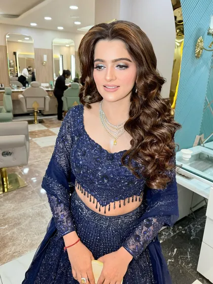This look is a testament to classic elegance, perfect for a formal engagement ceremony.