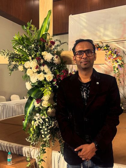 Our frontman standing by the stage setup for a private event. A lot of preparation goes into every single gig to ensure a flawless performance.