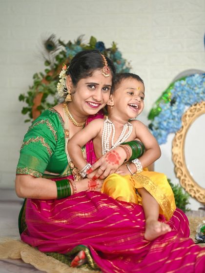 A joyous moment between a mother and her son during their Yashoda-Krishna photoshoot.