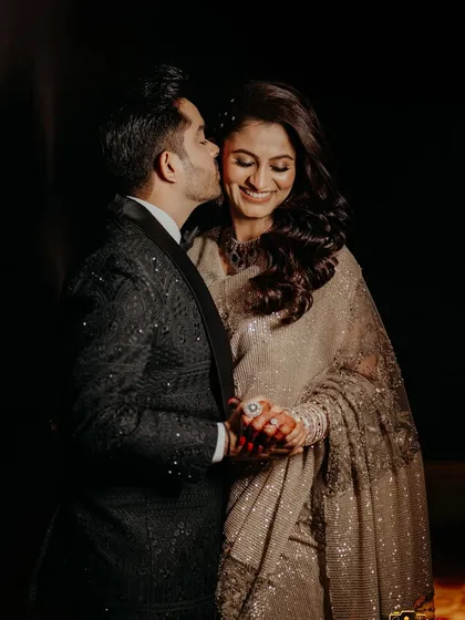 A sweet kiss on the cheek, a perfect candid moment.