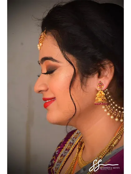 A side profile showing the soft contour and the beautifully blended eyeshadow. This elegant South Indian engagement makeup is perfect for capturing timeless photos.