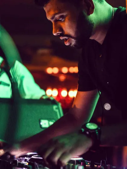 A candid moment of intense focus. Every set is a journey, and I put all my concentration into selecting the right tracks to guide the night's vibe.