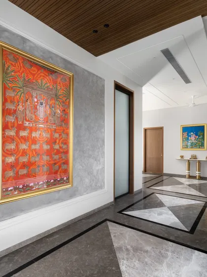A vibrant Pichwai painting brings life and cultural richness to this corridor. We often use hallways as galleries to showcase art, transforming them from simple passages into destinations in their own right.