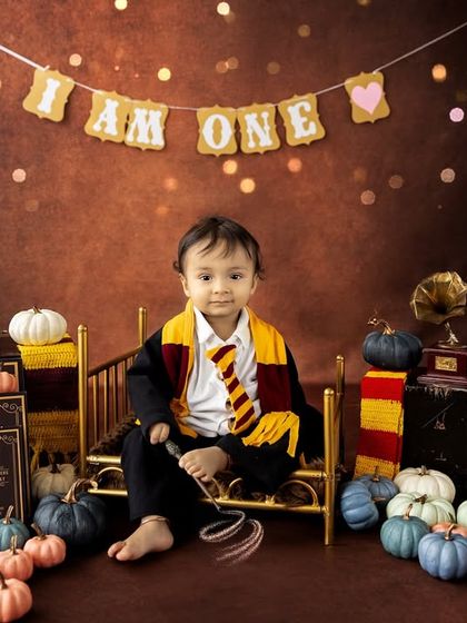 A straight-on portrait from the Harry Potter session, showing the detailed costume and props. These themed shoots result in truly unique and personalized birthday photos.