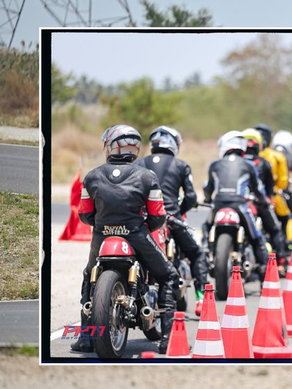 A group of riders follows a coach during a line-following drill. This exercise is crucial for learning the optimal racing line and understanding how to navigate the track efficiently.