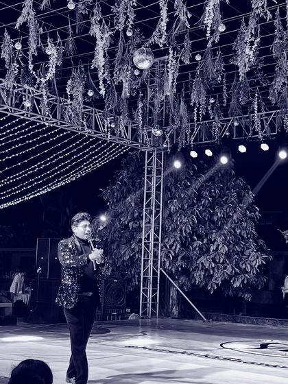 A different perspective of me on stage, with the beautiful decor in the background. The ambiance plays a huge role in setting the mood for the evening.