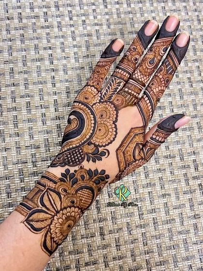 A modern and chic design for the back of the hand, featuring a mix of geometric shapes and floral elements.