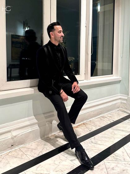 A relaxed moment in the velvet tuxedo. The richness of the fabric and the sharp tailoring ensure the look is impeccable from every angle.