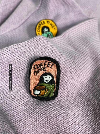 This shot highlights the rectangular 'Coffee Time' badge. I enjoy making slight variations in my designs, so each hand-embroidered piece feels like a unique little illustration you can wear.