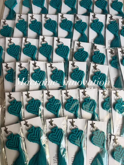 A sea of teal heart keychains, all individually packed and ready for a bulk order.