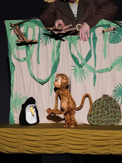 A scene from 'Penguin in my Pocket' from the USA, a charming show featuring a scientist penguin and an artistic monkey. This performance uses a variety of puppets, including these delightful marionettes.