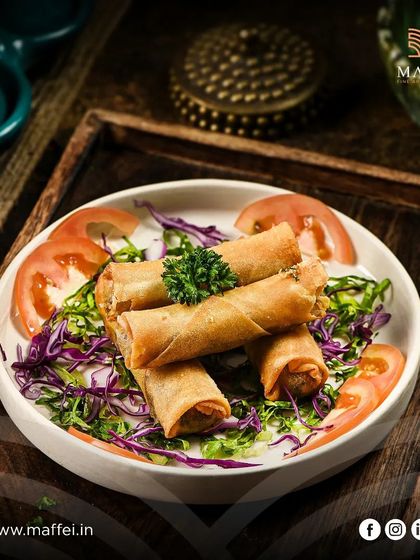 Rakakat Jibneh, also known as cheese rolls. These crispy, golden-fried spring rolls are filled with a delicious blend of cheeses and herbs, making for an irresistible hot mezze.