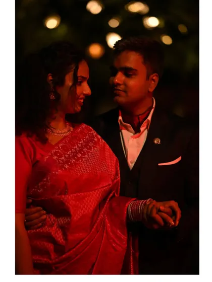 A beautiful evening shot from one of our wedding functions. I wore a stunning red saree, a classic choice for Indian celebrations, styled to feel both traditional and modern.