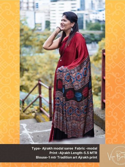 The joy of wearing a handpicked saree. This photo captures a happy moment with a customer in our red Ajrakh modal saree, featuring a stunning printed pallu.