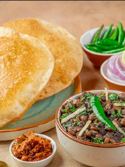 I bring the authentic taste of Delhi to Mumbai with my classic Chhole Bhature. You get fluffy, perfectly fried bhature served with a bowl of spicy and flavourful chhole, pickles, and onions.