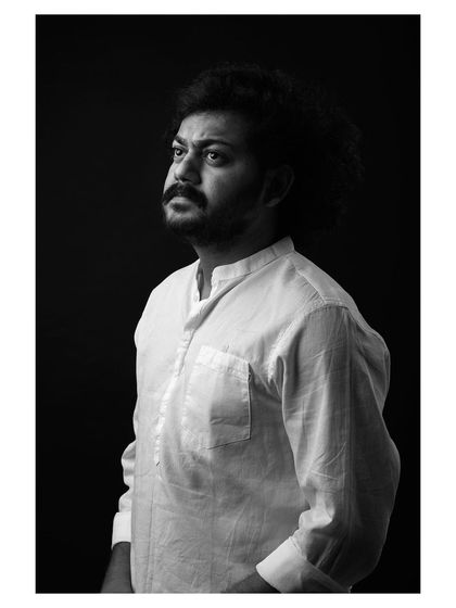 A strong and character-driven black and white portrait of an actor. The lighting is dramatic, highlighting his features and creating a compelling headshot.