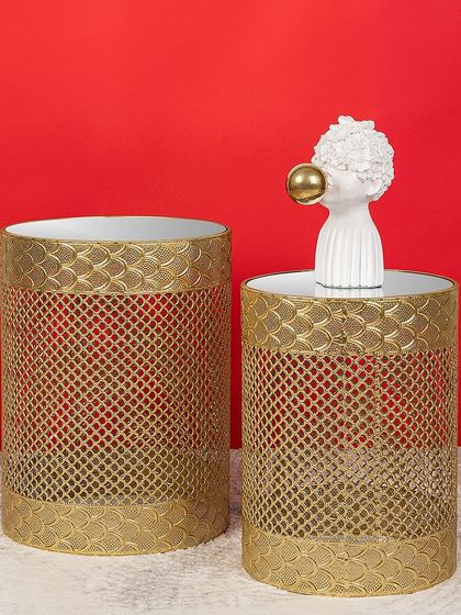 Another stylish set of two nesting tables with a golden mesh base and mirrored tops. These pieces are perfect for adding a touch of glamour and reflective light to your living space.