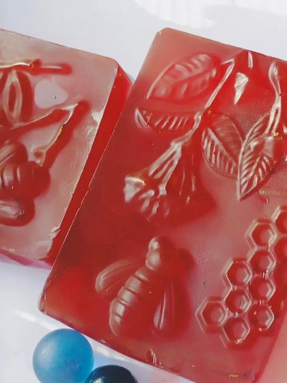 Another look at my intricately molded red herbal soaps. The bee and honeycomb design highlights the natural ingredients I use.