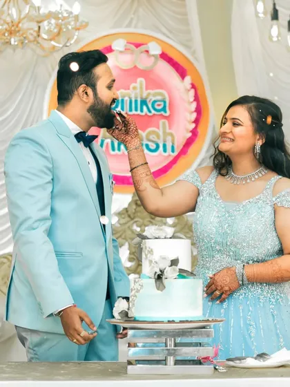 The cake cutting ceremony at an engagement party, a sweet moment of celebration for the newly engaged couple.