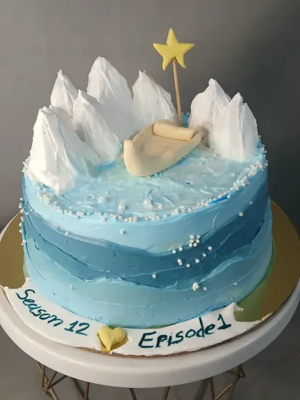 A cake depicting a boat in icy waters, created for a special themed request.
