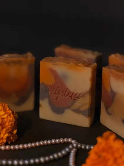 Our Noor Santhal soap, specially crafted for the Diwali tradition of 'pahili anghol'. It's a blend of sacred Sandalwood, Rose, and Frankincense, colored with natural clays to honor heritage in every wash.