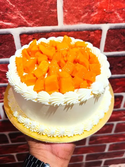A simple and delicious seasonal mango cake, topped with fresh, juicy chunks of Alphonso mango.