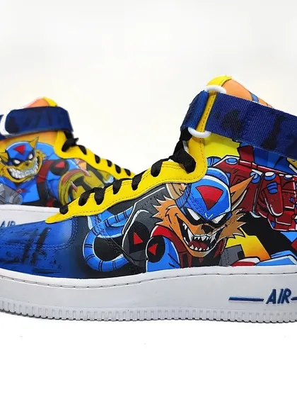 Both shoes of the SWAT Kats pair, featuring the radical squadron in action. The bright yellow and blue colour scheme is straight out of the classic cartoon.