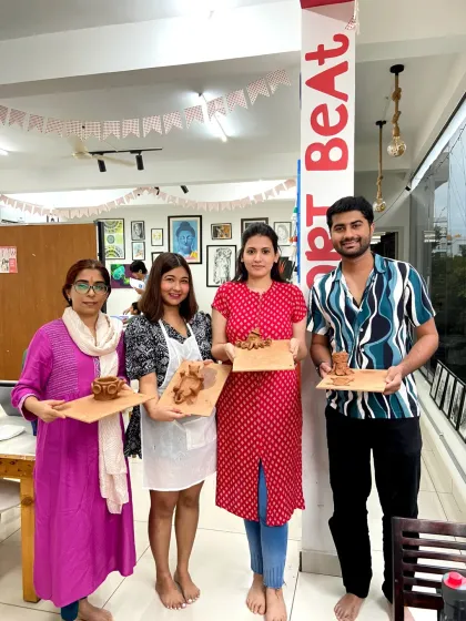 A group of participants with their finished clay pieces. The workshop is a great way to meet like-minded people and learn a new skill.