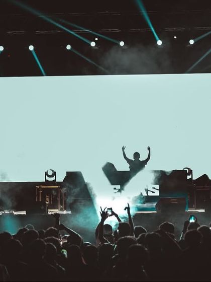 My silhouette against the giant screen at IIM Indore. The visuals are a key part of my performance.