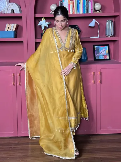 For her birthday, I styled Bhumi Pednekar in this vibrant yellow salwar suit. The intricate silver embroidery on the neckline and the flowing dupatta make it a cheerful and celebratory outfit.