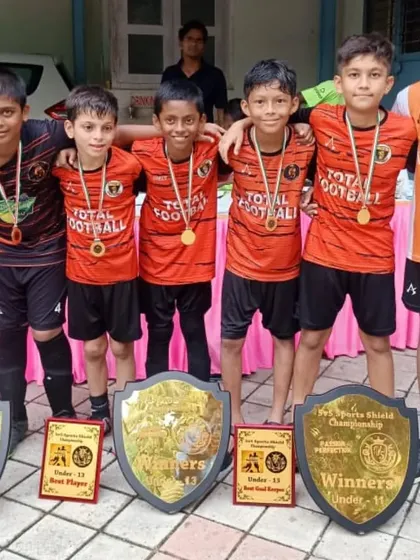 A group of our champions from the 5v5 Sports tournament, where we won titles in four different age categories.