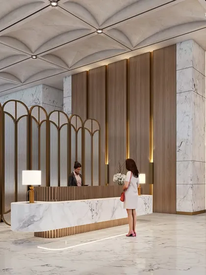 The reception lobby for a new luxury development in South Mumbai, meticulously sculpted to marry exquisite design detail with functionality. A vaulted ceiling, wood paneling, and a floating marble desk create an elegant and welcoming first impression.