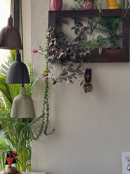 A custom-made teak wood plant frame is a perfect way to add greenery to a small space. This one has been a dynamic part of our client's home for years, always looking lush and beautiful.