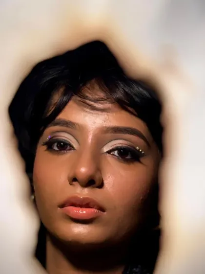 A creative shot for this glam look, framed through a burnt paper hole. This adds an edgy, editorial feel to the otherwise soft and glamorous makeup.