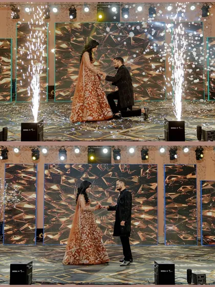 Your Sangeet is a full-blown production, and I capture it that way. This shot of Vivek proposing to Neha on stage, complete with pyrotechnics, shows how I document the grand, show-stopping moments of your celebration.